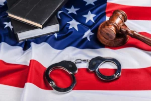 Handcuffs and judge's gavel representing qualifying crimes for a U-Visa in New Jersey