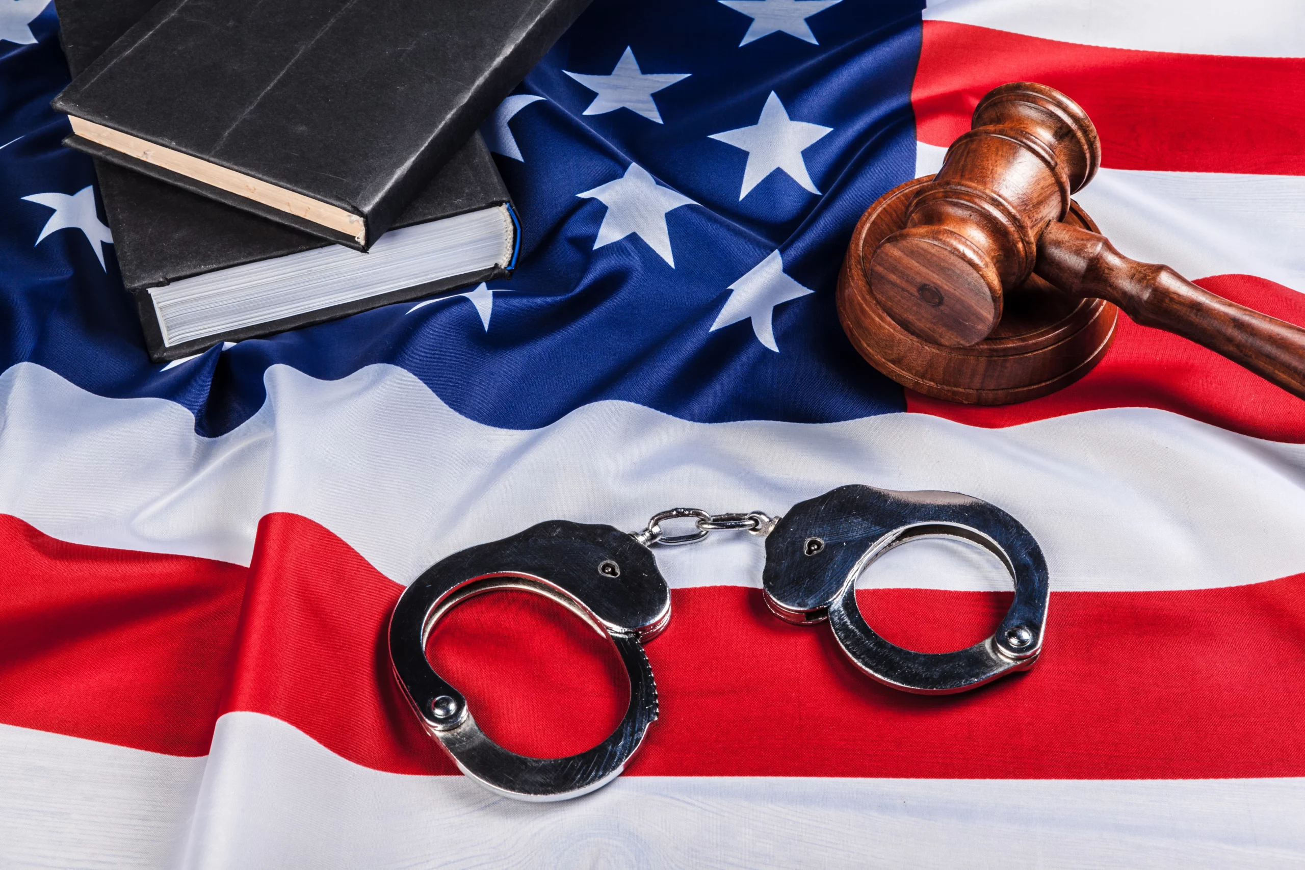 Handcuffs and judge's gavel representing qualifying crimes for a U-Visa in New Jersey